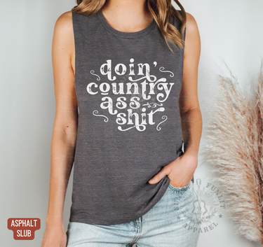 A woman wearing a gray tank top with the text
